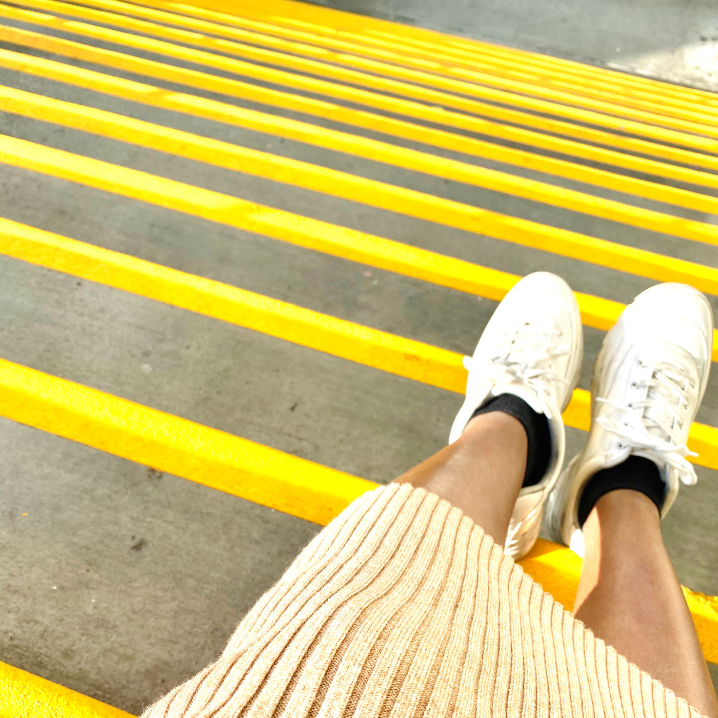 A serious meeting between sneakers and caution tape