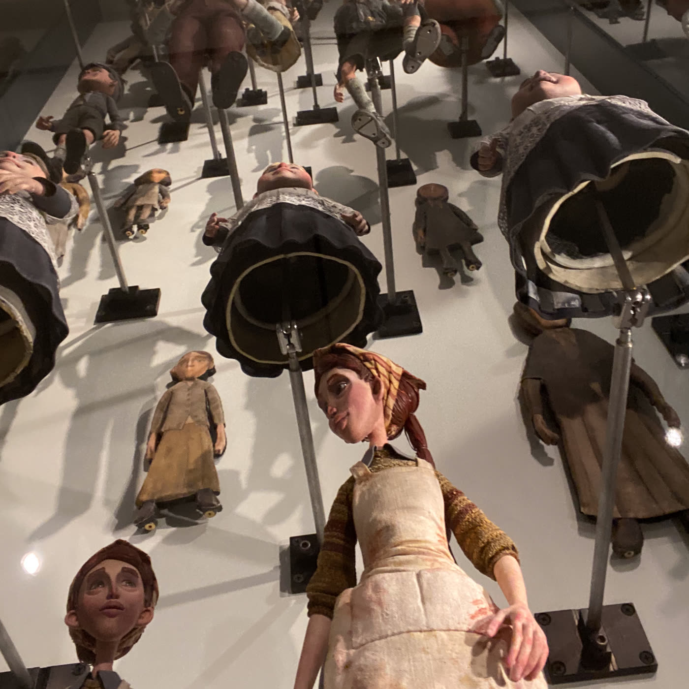 A room of puppets, mid-argument about who's in charge